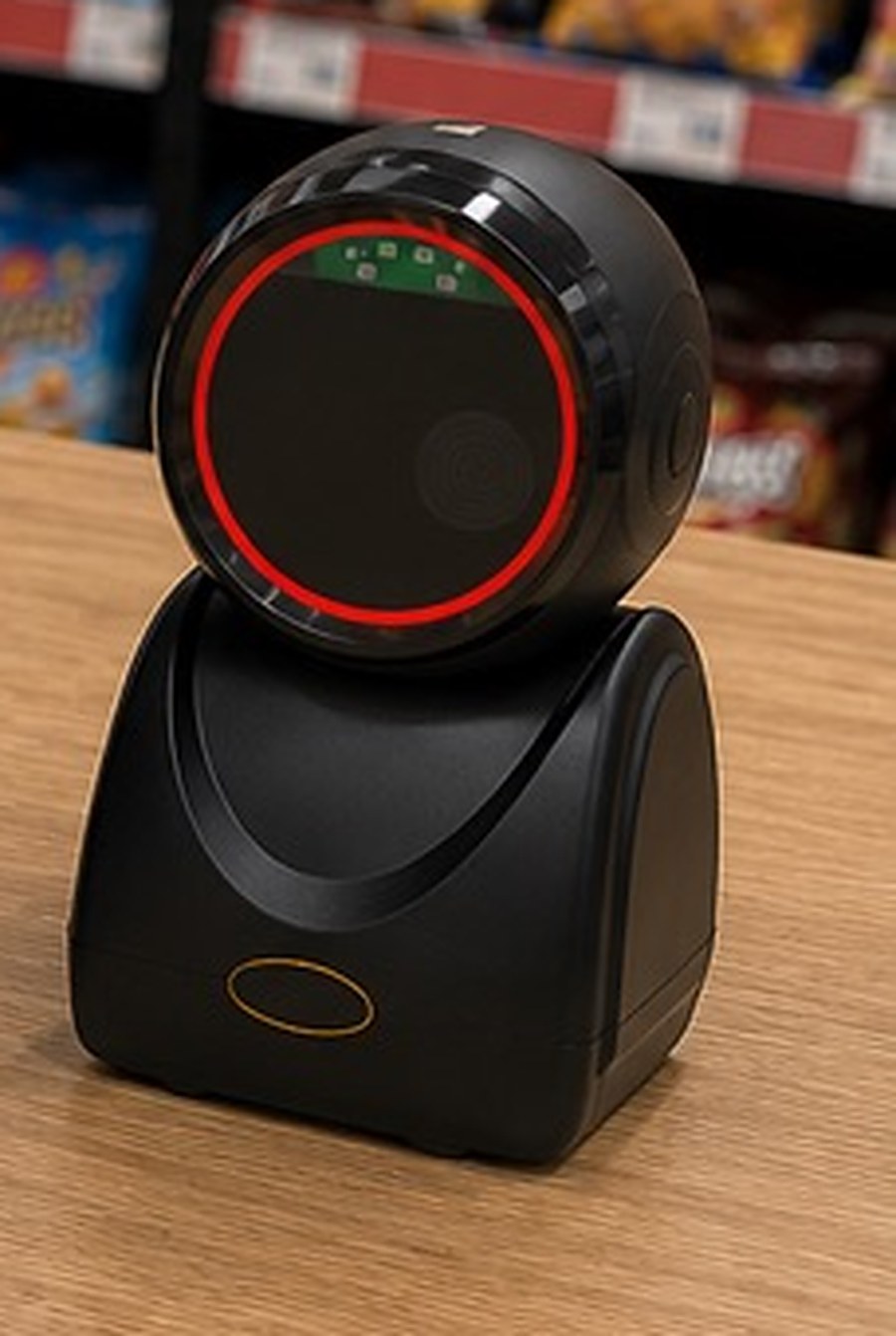 Lector de código de barras sobre el mesón de un minimarket, conectado al punto de venta GranLoop